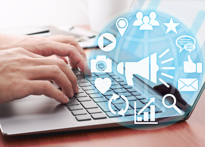 Social media marketing professional working on a laptop with digital marketing icons for content creation and online business growth.
